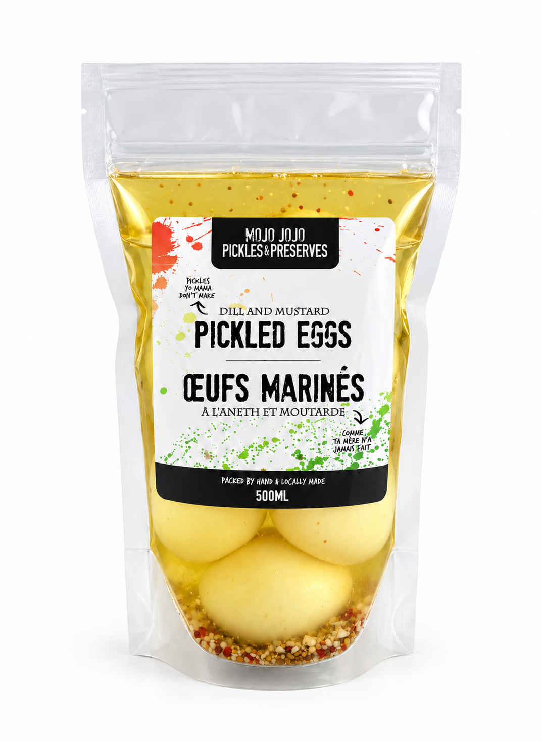 A 500ml stand-up pouch of Mujo Jujn Pickles & Preserves Pickled Eggs (Céufs Marinés) filled with yellow mustard and spices, containing four pale eggs at the bottom.